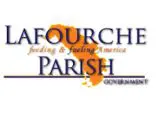 Logo of Lafourche Parish Government featuring an orange graphic element and text about Louisiana Claims Administrators.